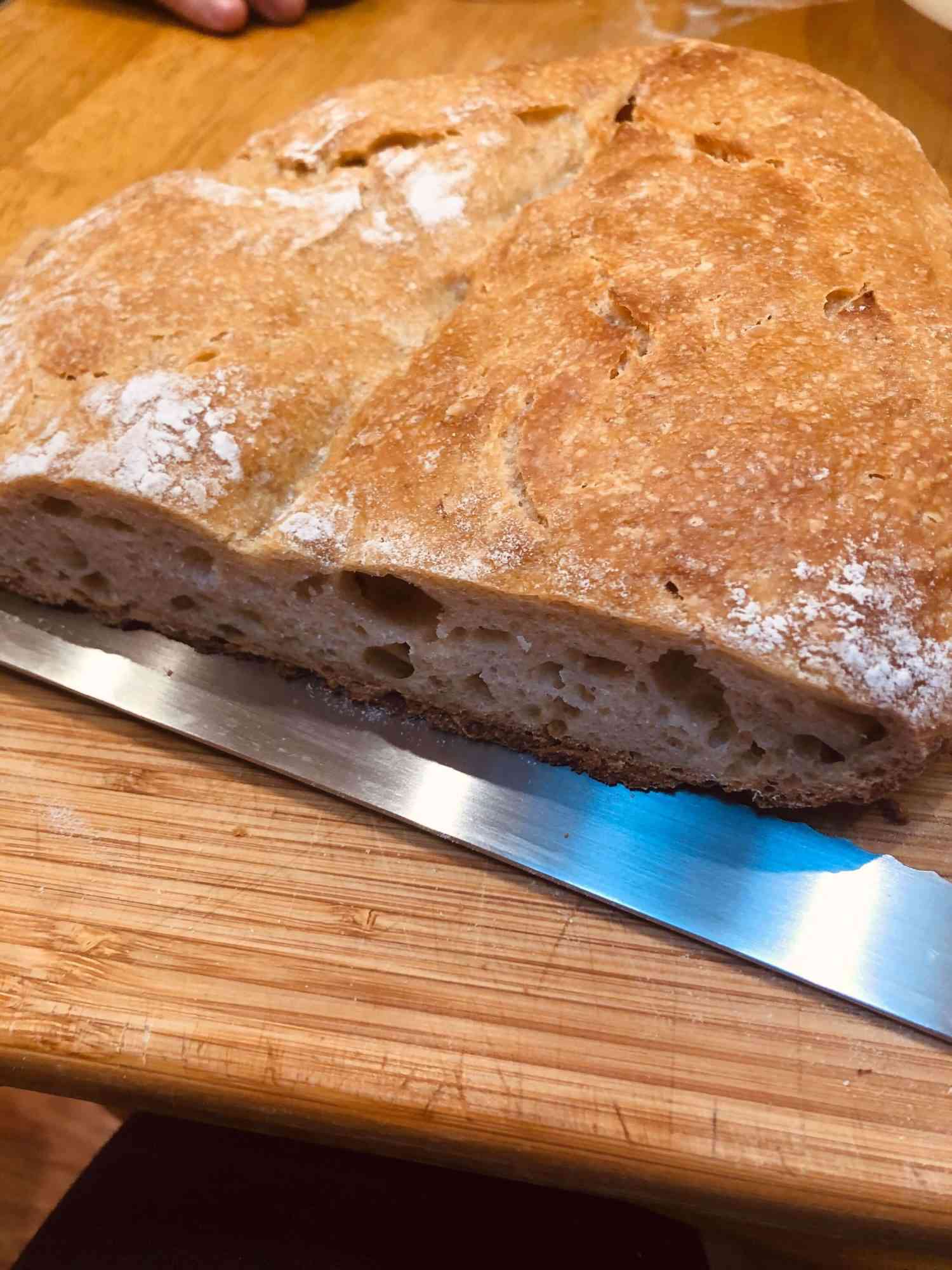 Loaf of sourdough that has several slices cut out of it