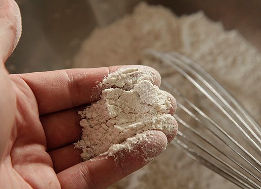 Chicken dredging mixture with added milk mixture to form crisp nuggets of flour.