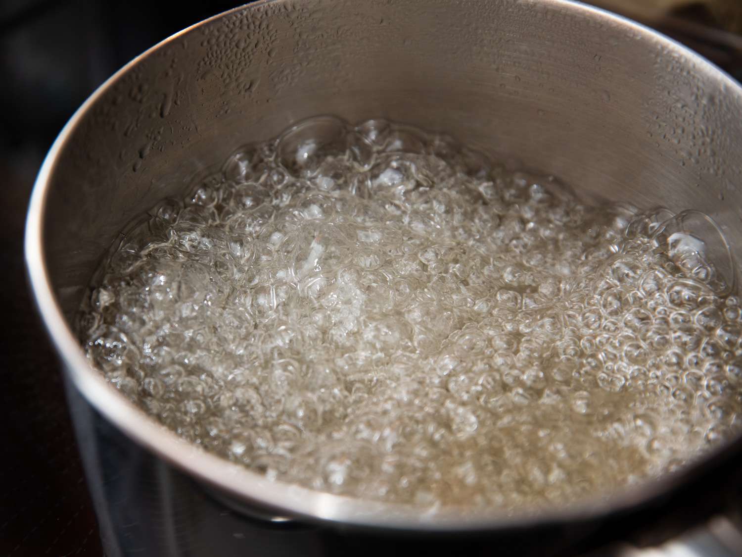Water and sugar boiling in a pot.