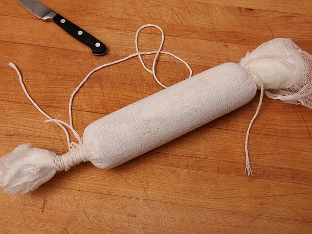 Foie gras in cheesecloth, tied at both ends. 