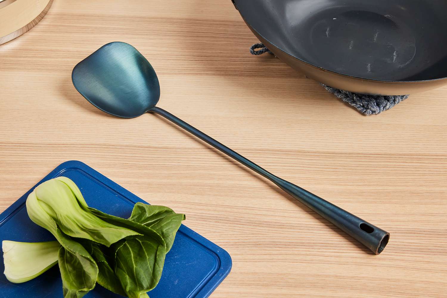 a wok chuan on a wooden countertop