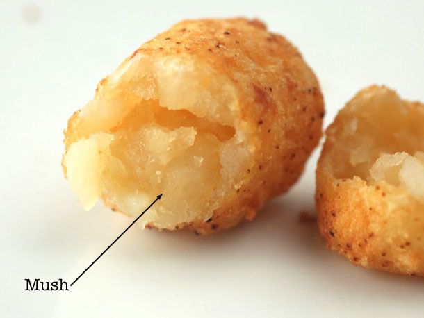 Cross-section showing mushy interior of refried tater tot.