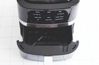 Cuisinart air fryer with an open basket showing control panel and brand name