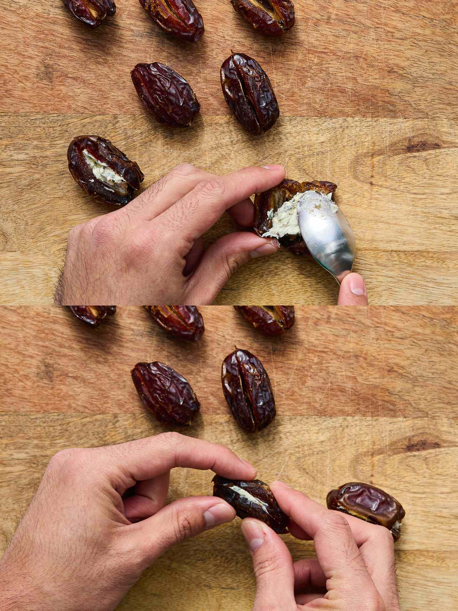 Hands filling dates with a spreadable filling displayed on a wooden surface