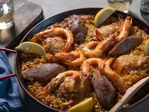 Stovetop paella mixta in a paella pan. 