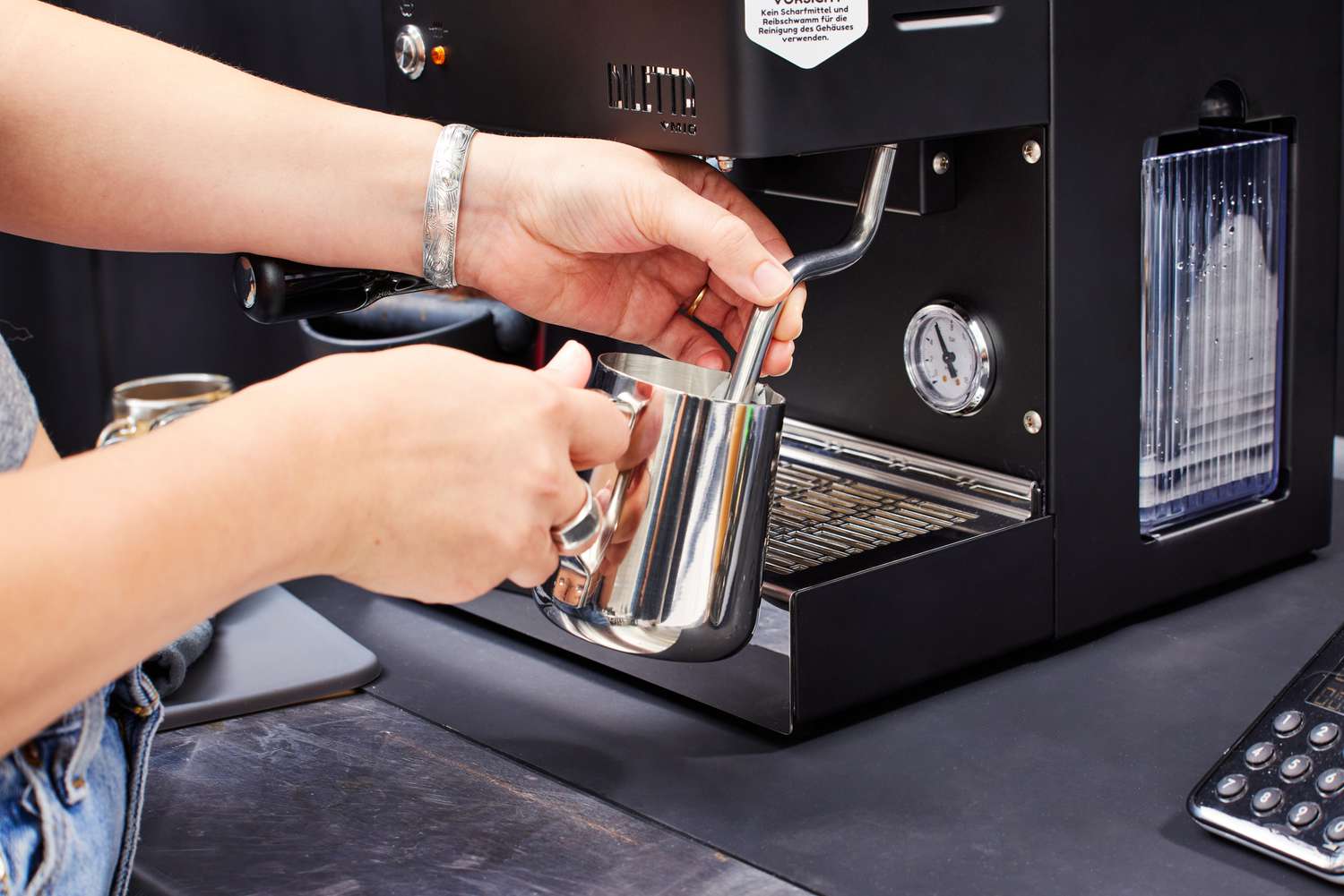Person steaming milk in the Diletta Mio Espresso Machine