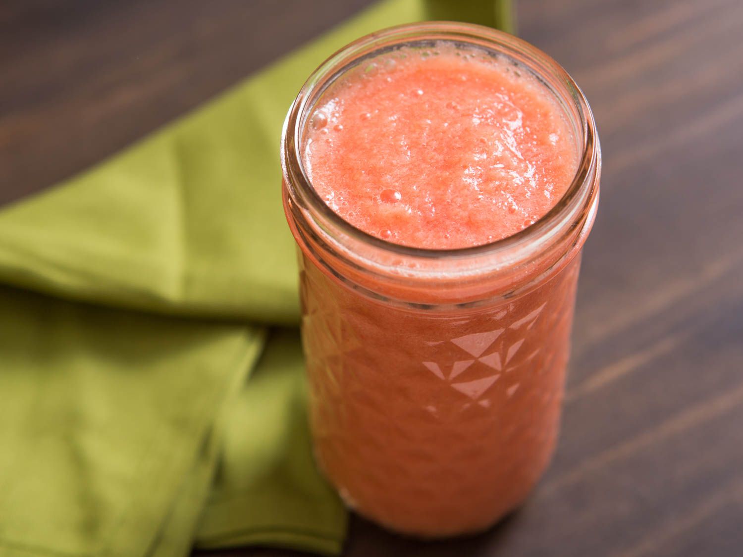 A canning jar filled with raw tomato coulis.