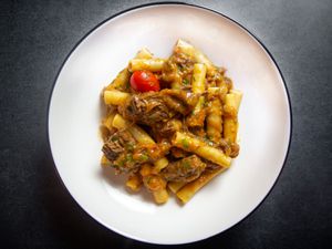 A plate of pasta alla Genovese made with ziti - or pasta with Neapolitan beef and onion ragù.