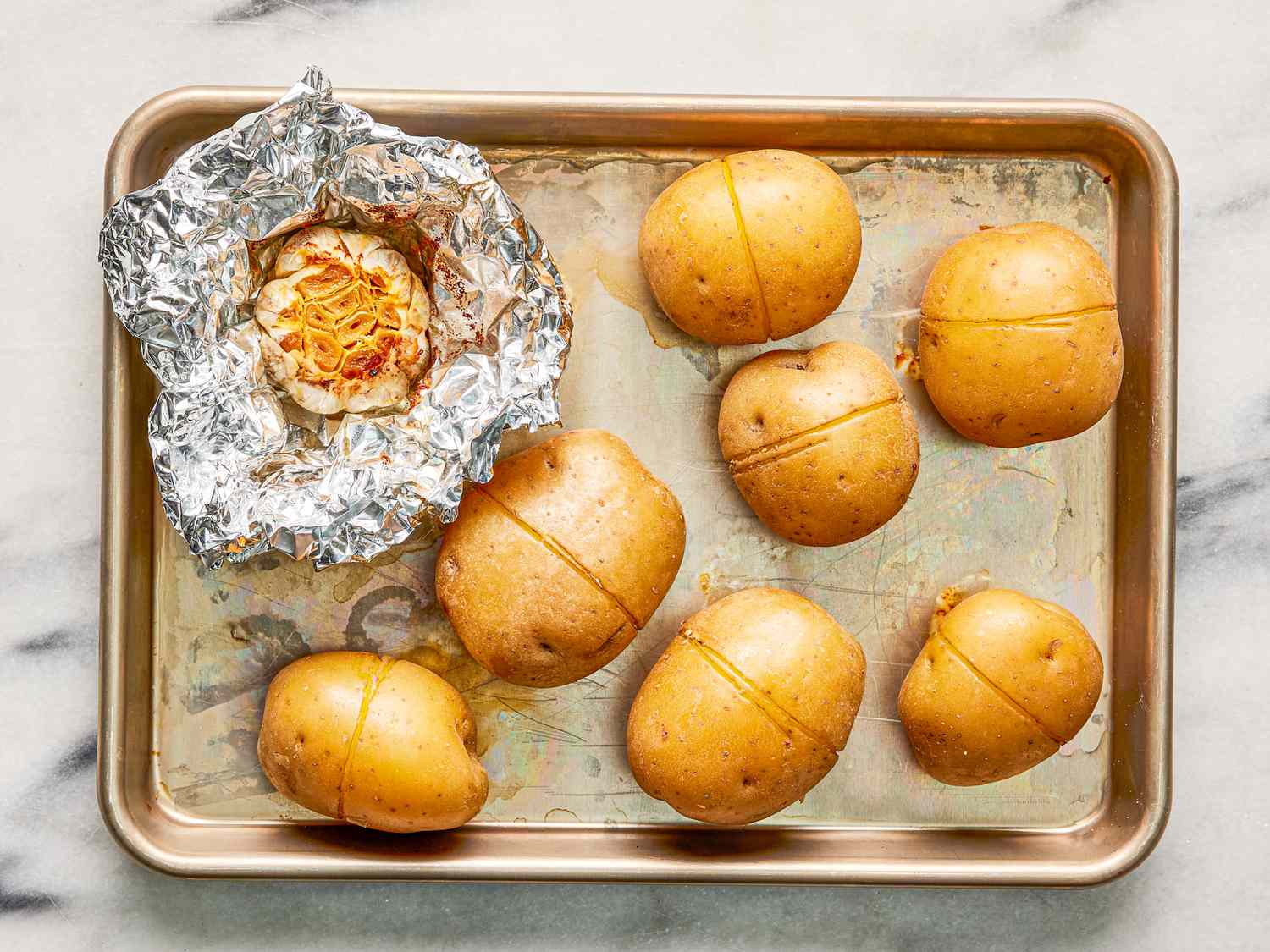 Overhead of roasted garlic and potatoes