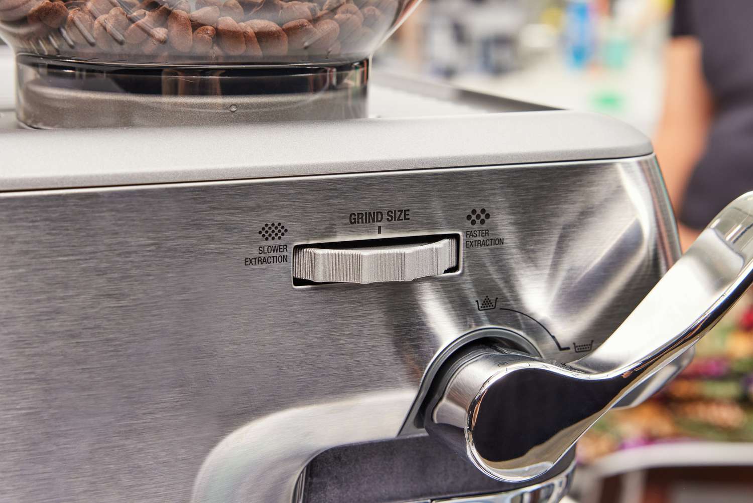 Close up of the coffee grinder size adjuster on the Breville Barista Express Impress