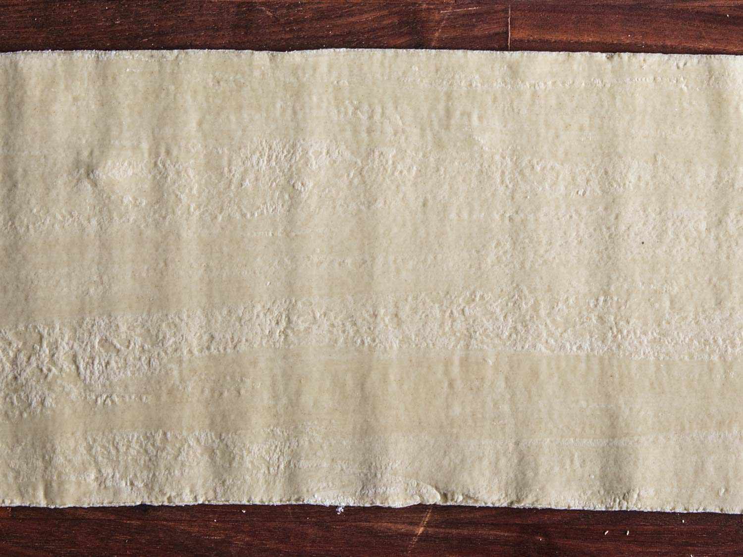 Close up of ramen dough sheet showing horizontal striping