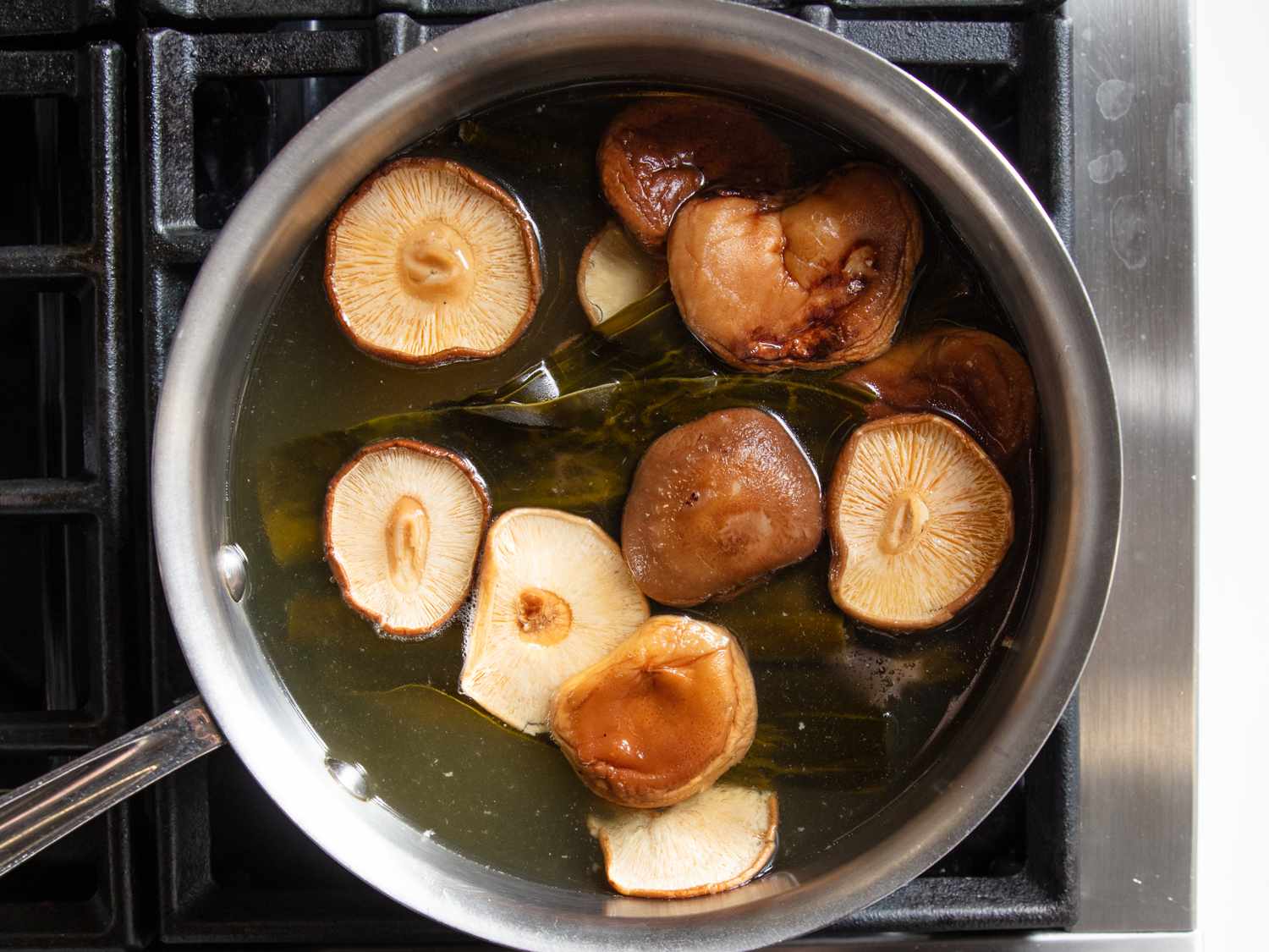 Soaking dried mushrooms and kombu to make dashi for a pot of Japanese ozoni.