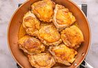 Cooked chicken pieces in a skillet, ready for a recipe or serving