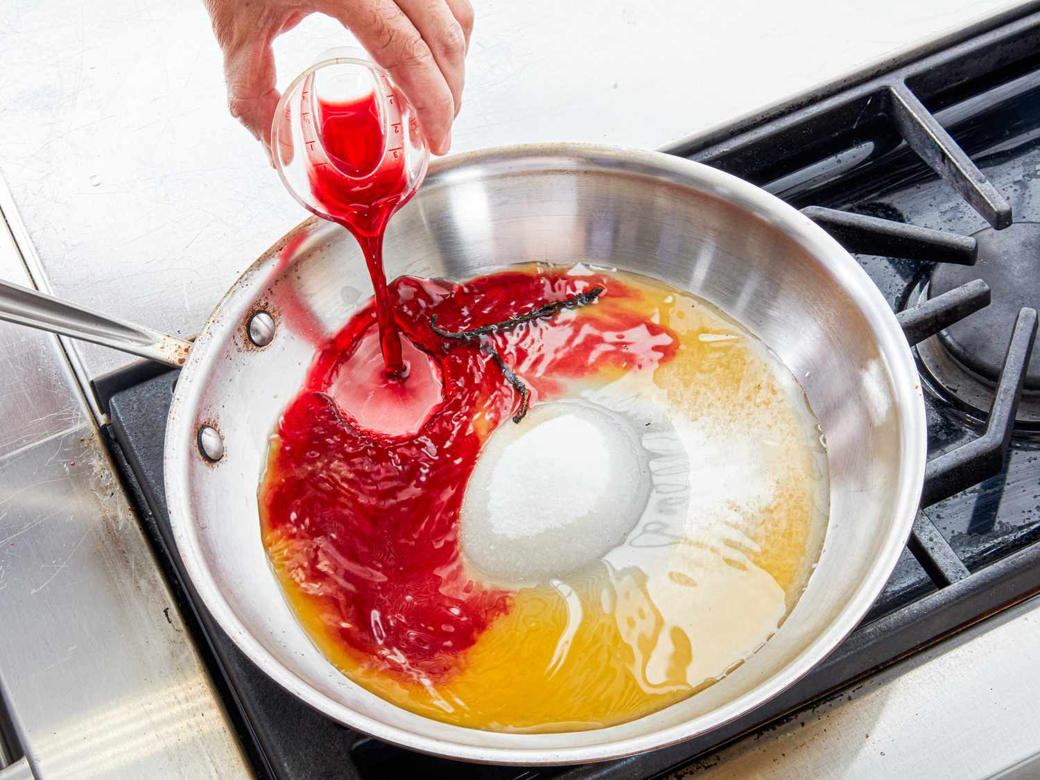 Overhead view of adding reserved cherry juice