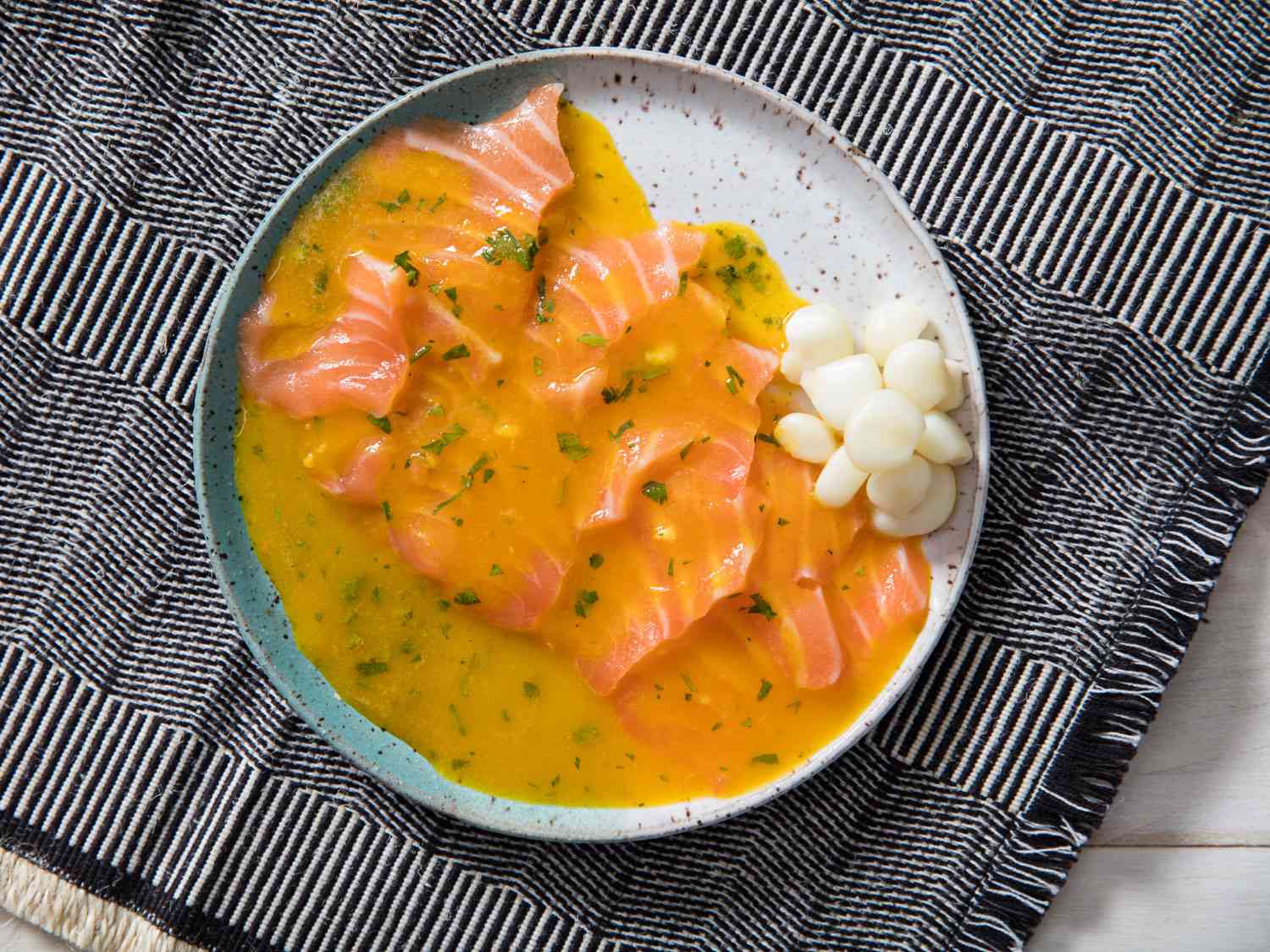 Overhead closeup of a plated serving of tiradito.