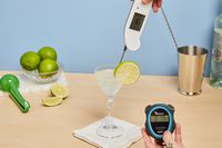 Person cheacking temperature of liquid in Bormioli Rocco America ’20s Glasses