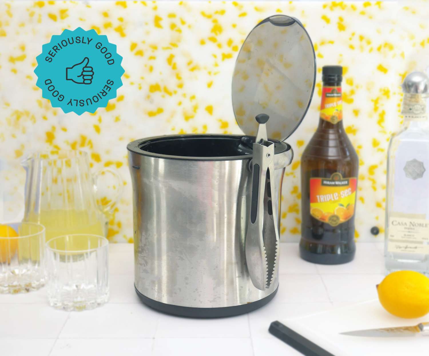 an ice bucket with the lid open on a white backdrop