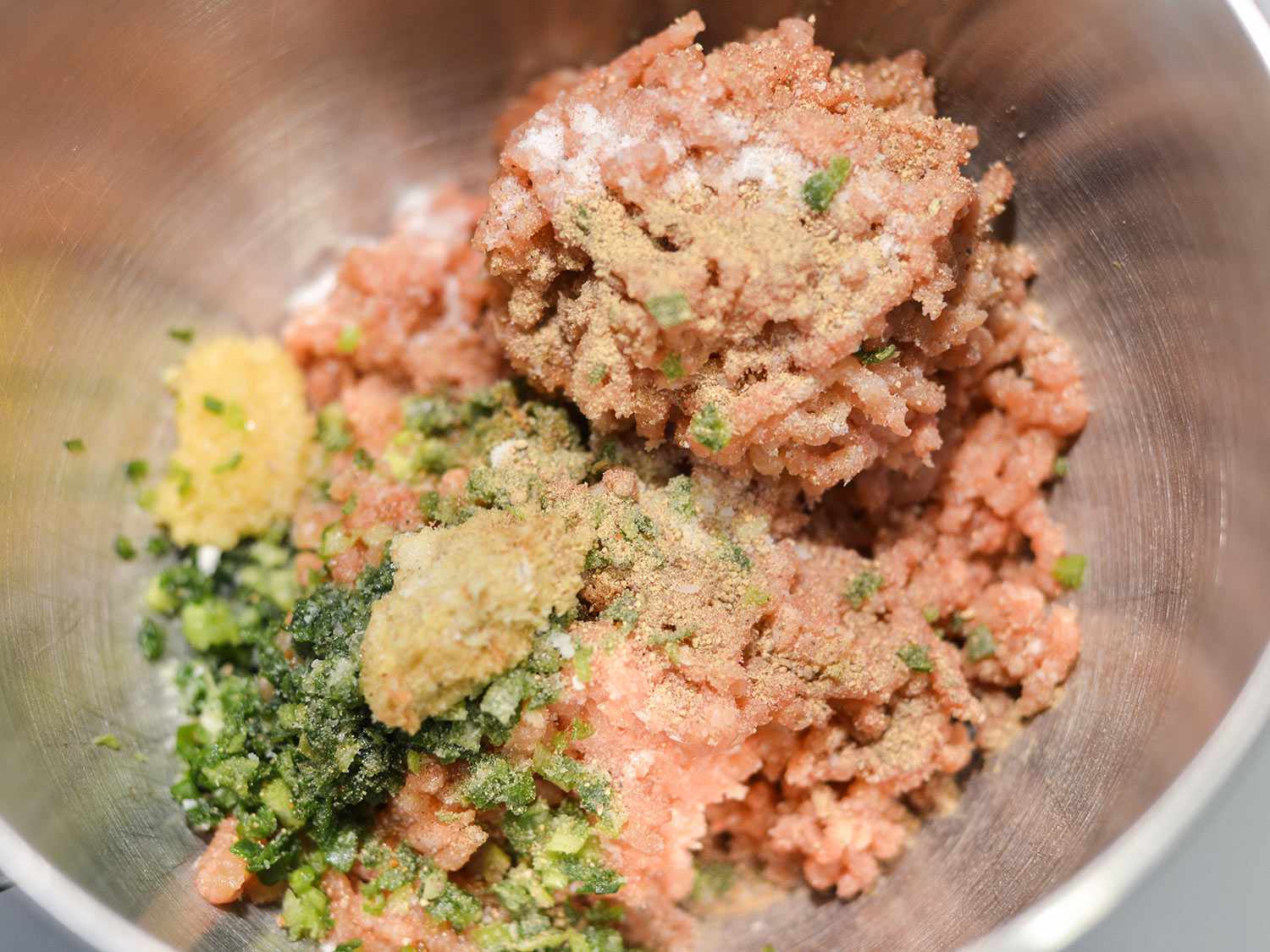 Overhead close-up of tusukune ingredients in a bowl.