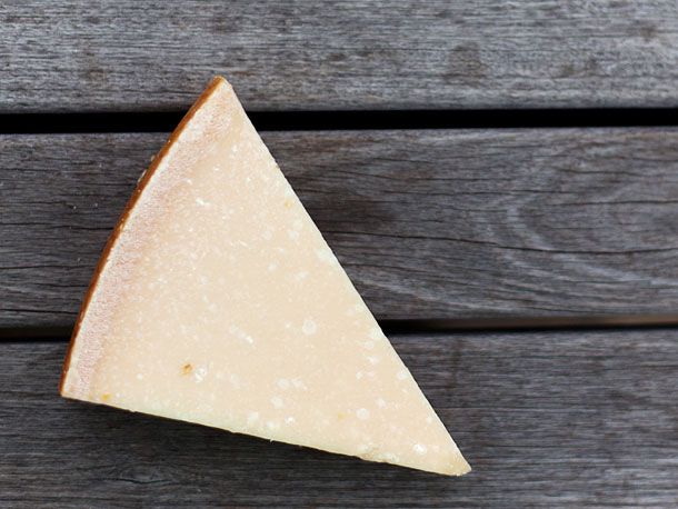 A cut wedge of Parmigiano-Reggiano Cheese