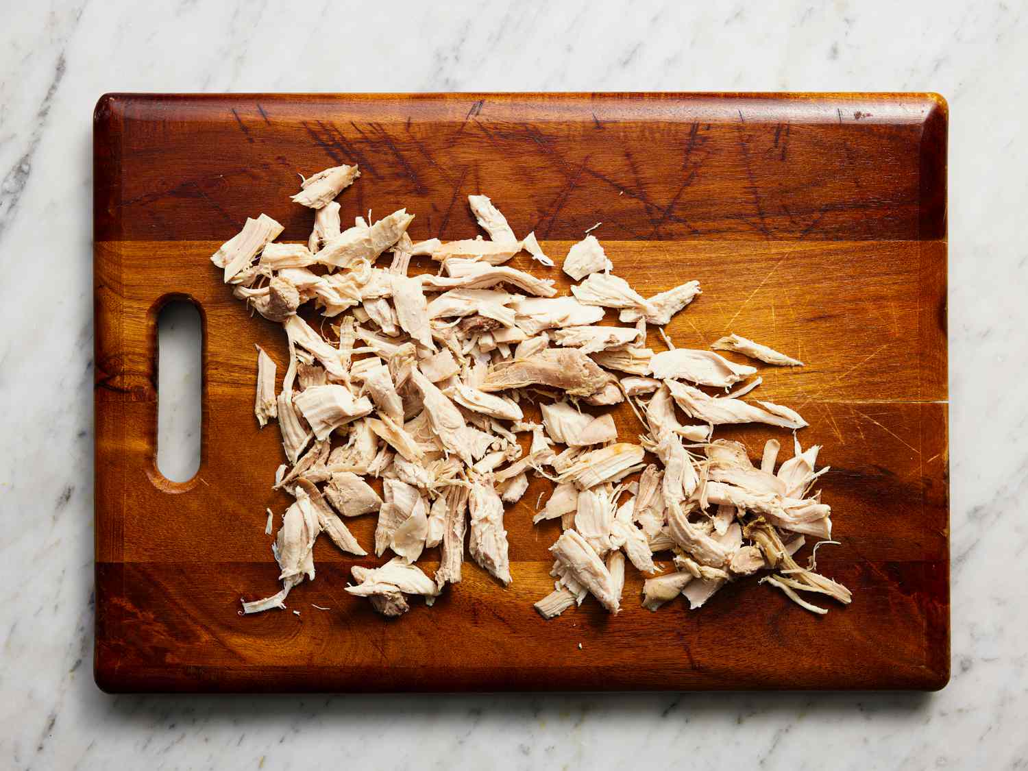 Turkey shredded on cutting board