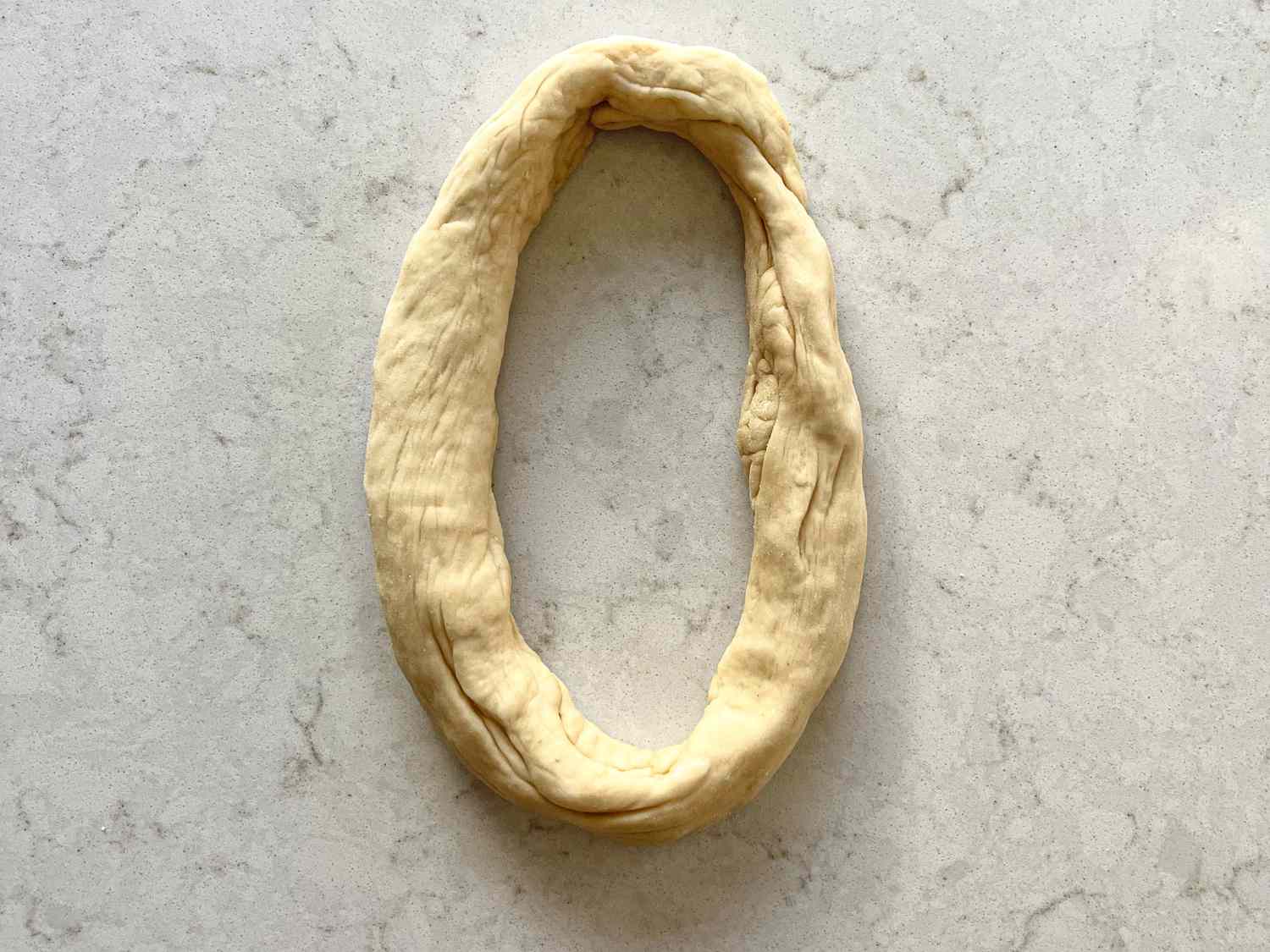 Overhead view of formed circle of dough