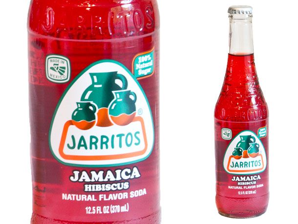 Closeup of a bottle of hibiscus Jarritos soda.