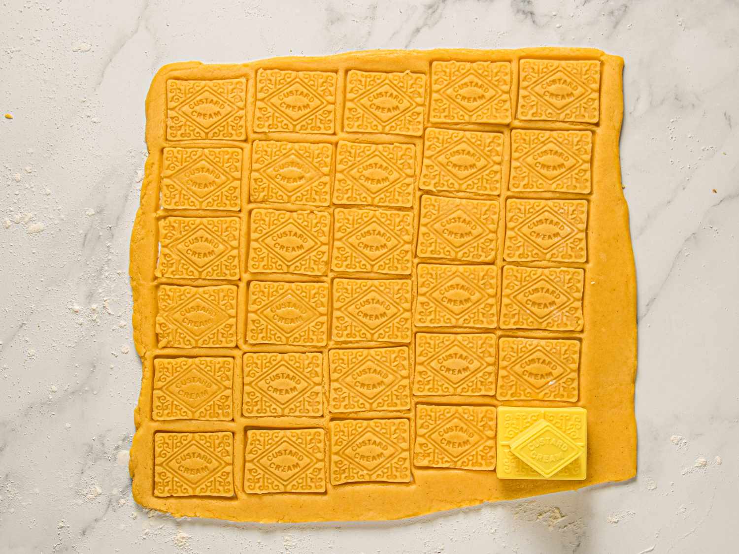 Overhead view of cutting cookies out 