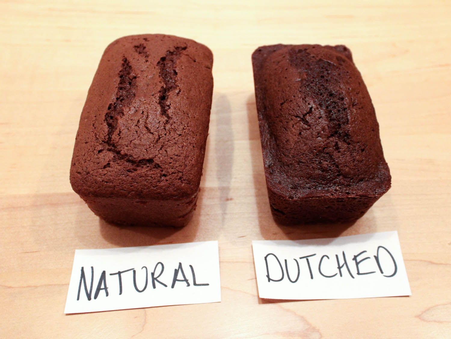 Side by side chocolate cakes made with natural and dutched cocoa powder