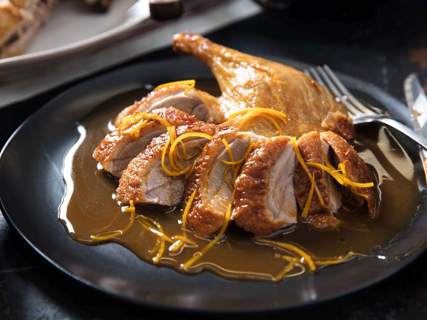 A plate of Duck à l'Orange with sauce
