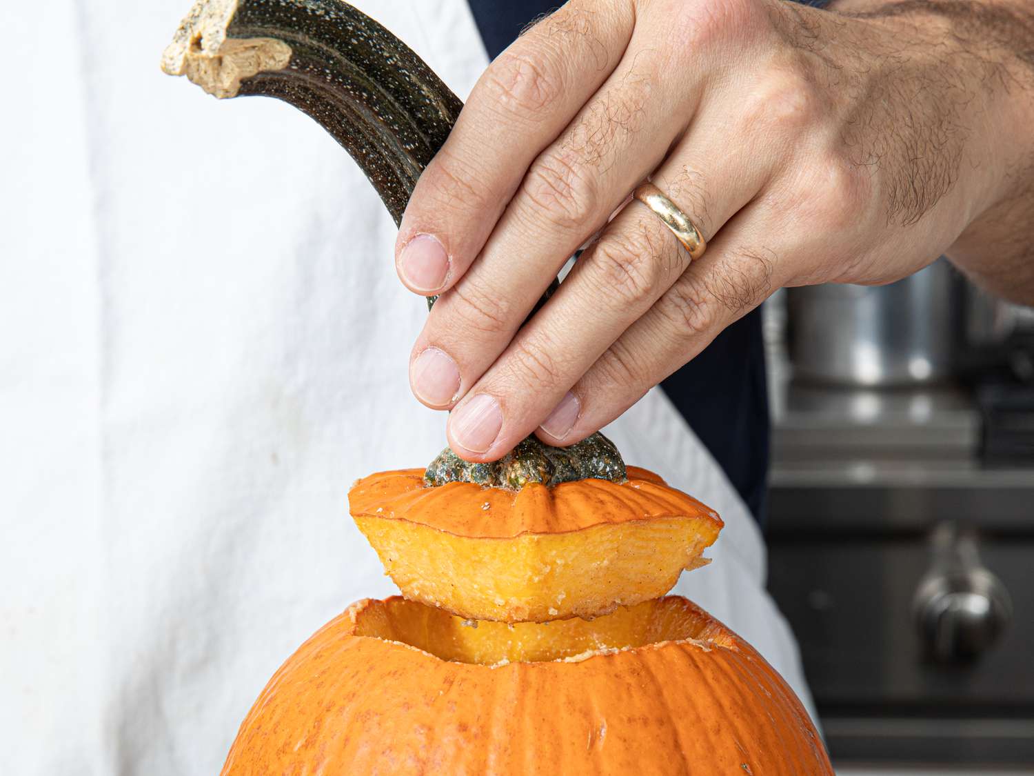 Side view of removing the lid