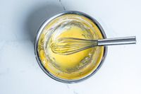 Winco Stainless Steel Piano Wire Whip in a bowl