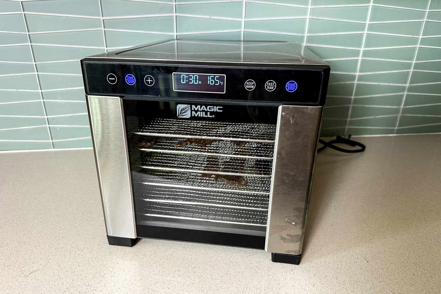 The Magic Mill food dehydrator on a kitchen countertop