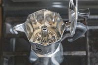 The inside of the Bialetti Moka Express moka pot on a stovetop.