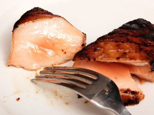 The medium-rare interior of miso-glazed salmon fillet. 