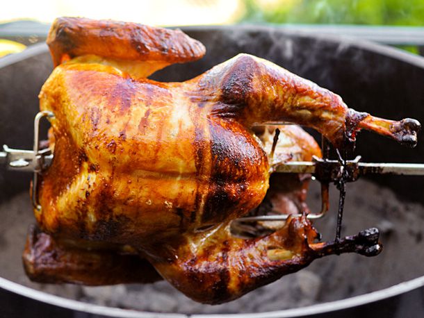 A turkey being cooked on a rotisserie. 