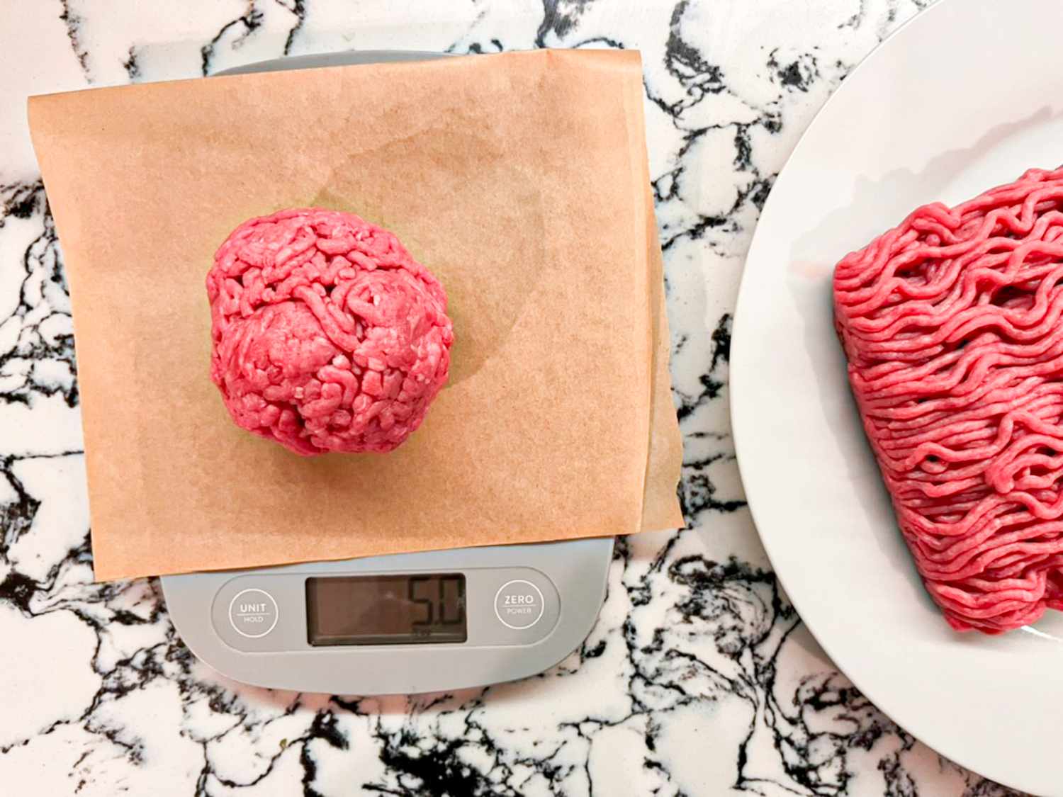 Ball of ground beef on a kitchen scale