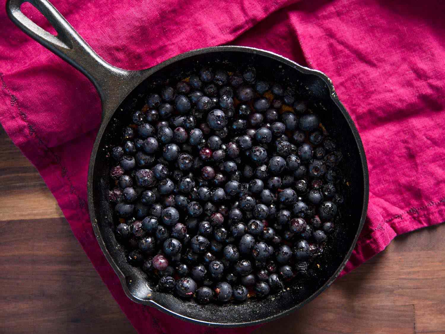 Broiled blueberries in a cast iron skillet