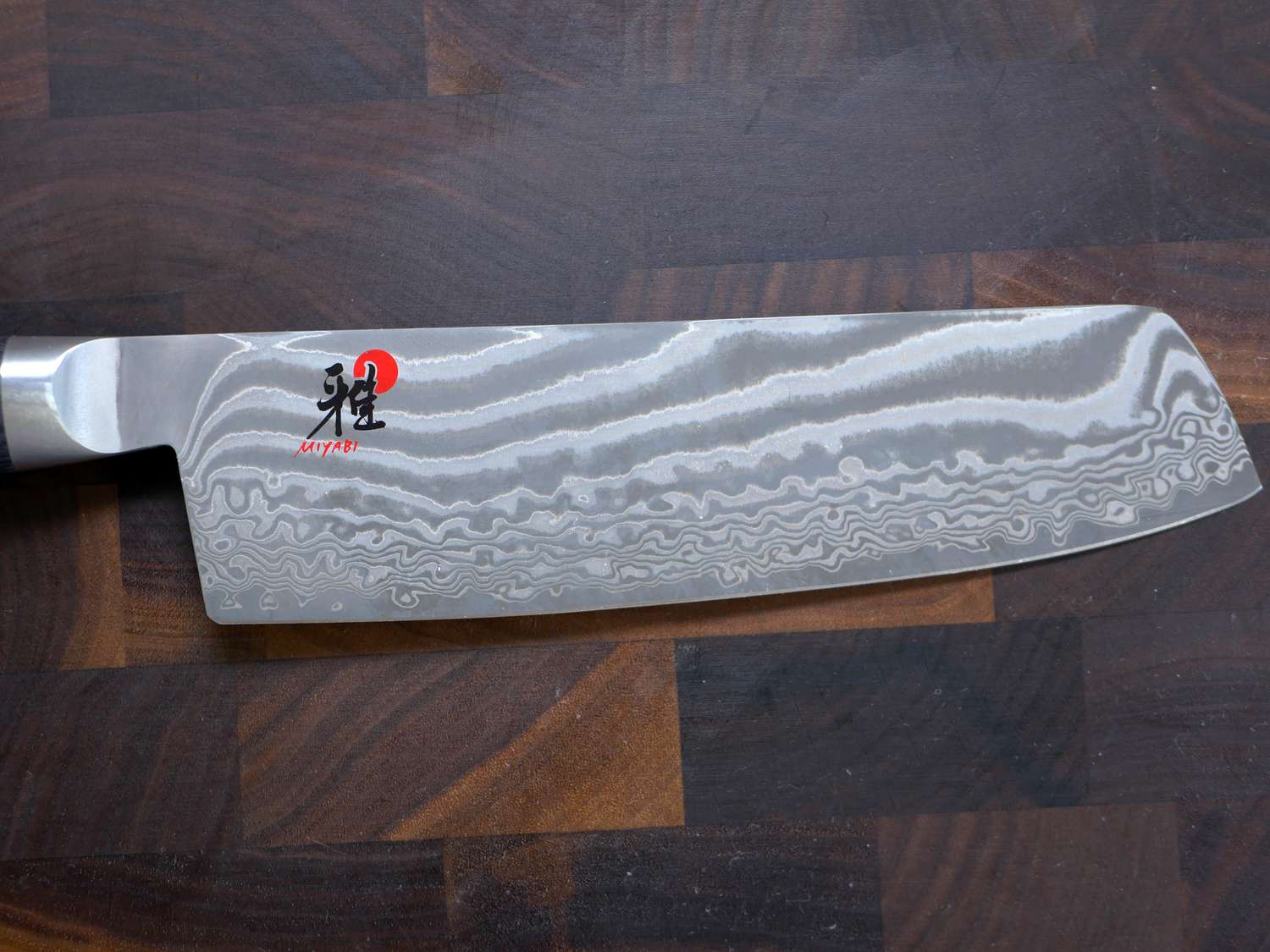 a closeup of the damascus pattern on a miyabi knife