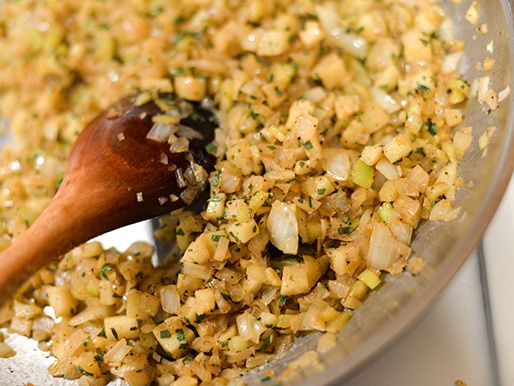 Sauteing stuffing ingredients.