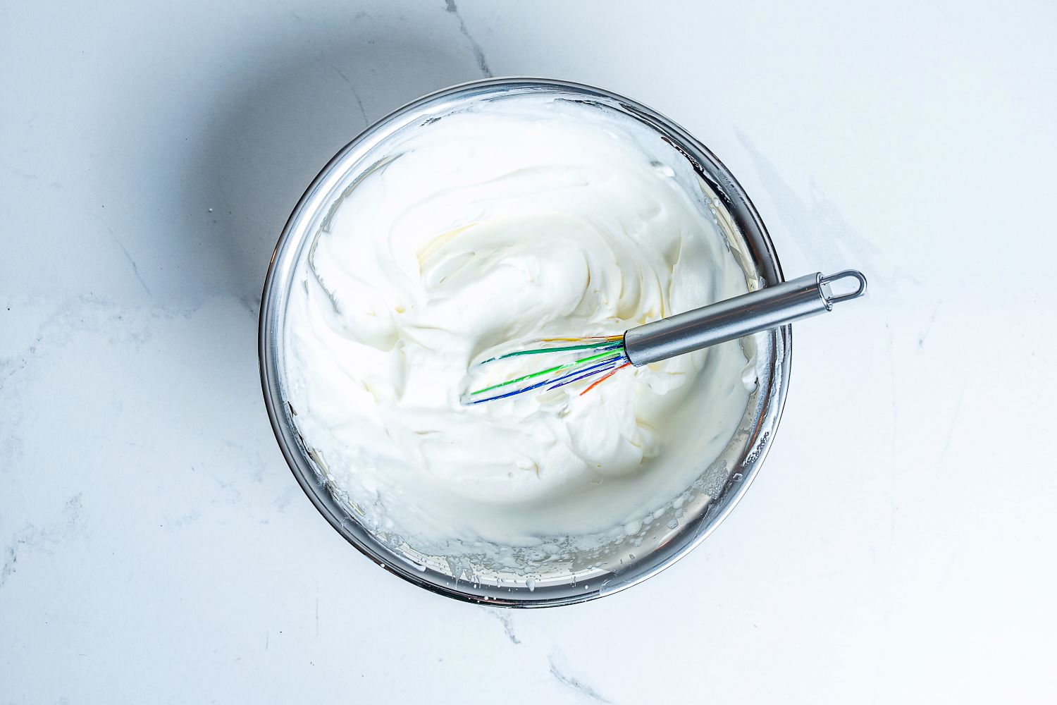Kuhn Rikon Silicone Rainbow Whisk in a bowl