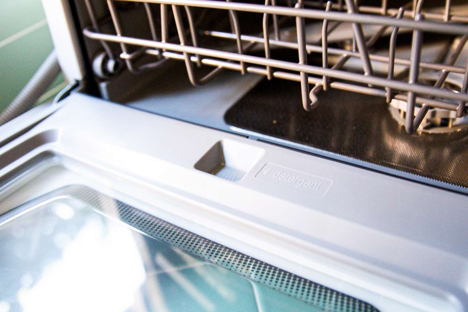 The detergent well of the Hermitlux countertop dishwasher.