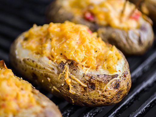 The pimento cheese baked potatoes finishing up on hte grill, nearly ready to serve.