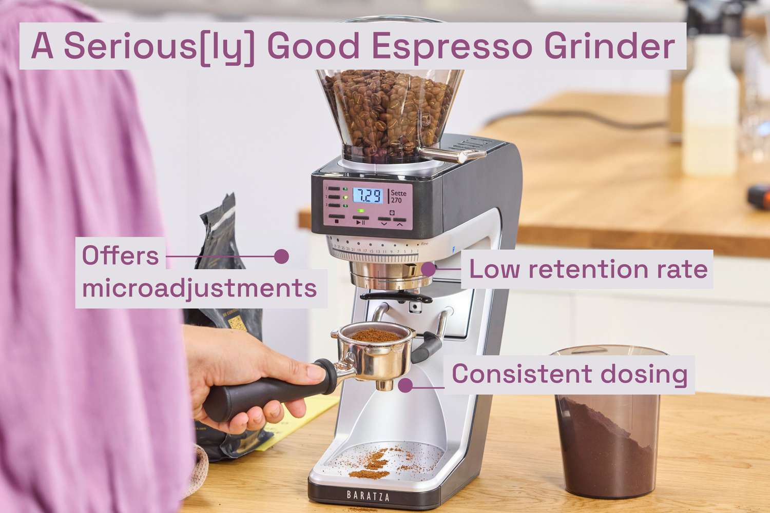 The Baratza Sette 270 espresso grinder being used to grind espresso beans into a portafilter