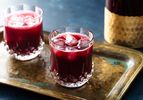 Two Jamaican sorrel hibiscus drinks resting on an old copper platter
