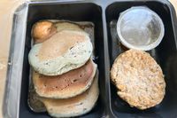 A Factor meal on a wood surface