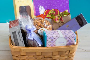 A basket of different candies and treats for Easter. 