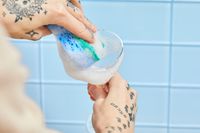 Person cleaning Bormioli Rocco America ’20s Glasses