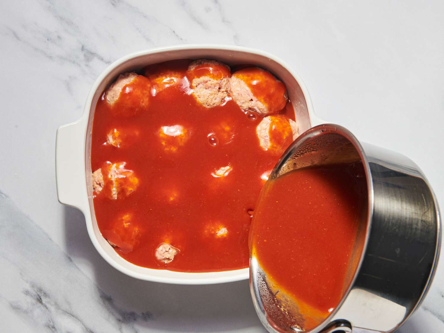 Overhead view of pouring glaze
