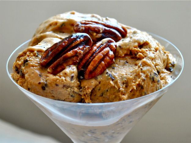 Coffee caramel ice cream topped with candied pecans in a martini glass.