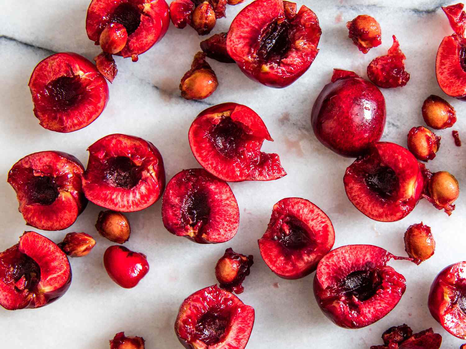 Pitted cherry halves and pits.